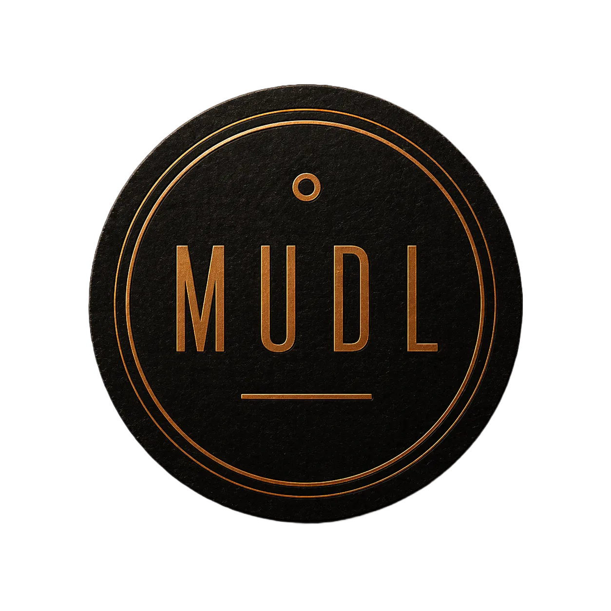 The Mudl coaster stamp: copper lettering reading MUDL inside a double copper ring on a black textured coaster, a small ring above the wordmark and a short rule beneath it.